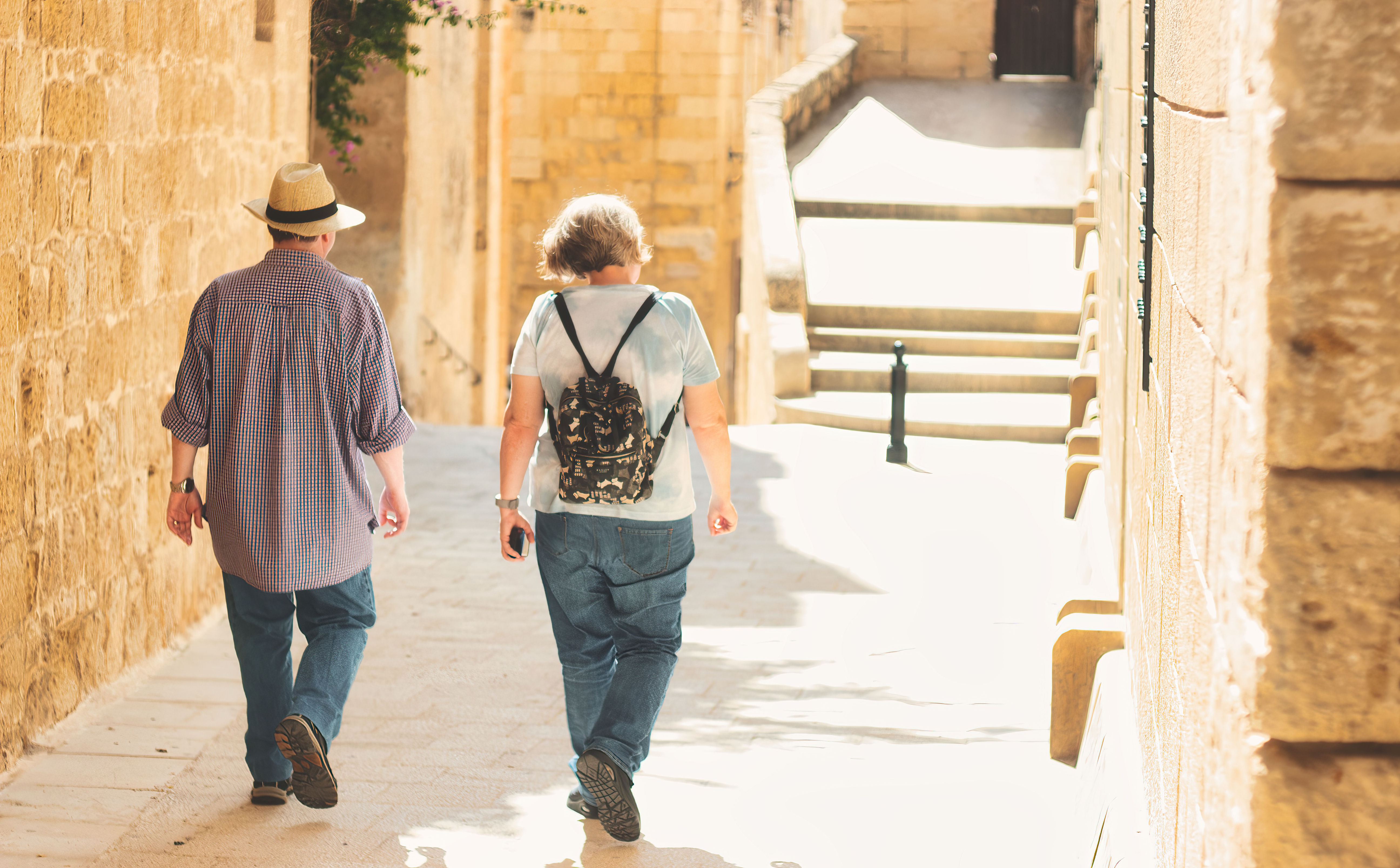 Older couple walking abroad