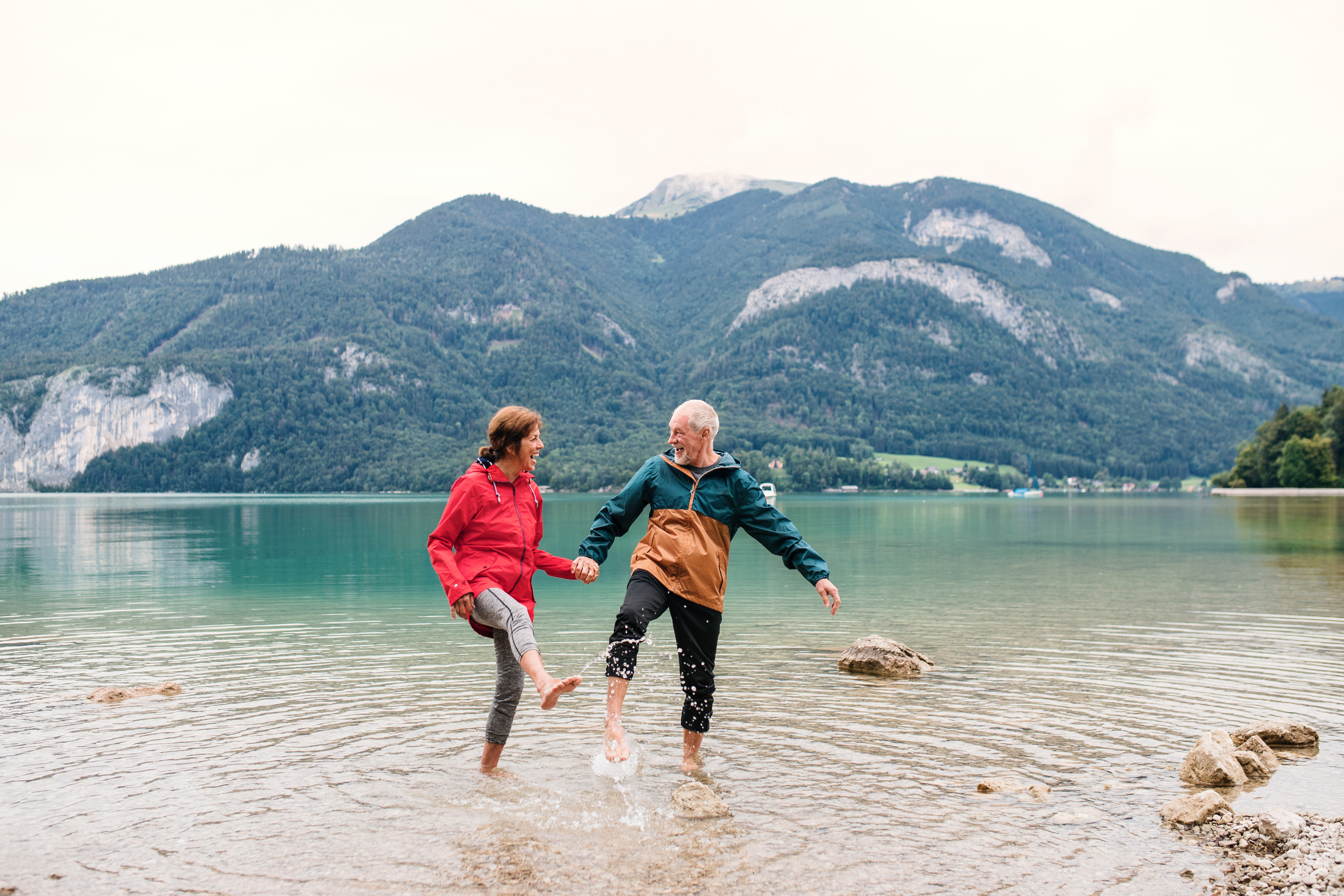 Retired couple walking by a lake